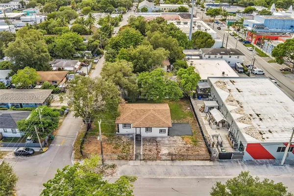 an aerial view of a house with outdoor space
