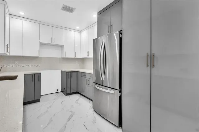 a kitchen with appliances cabinets and a sink