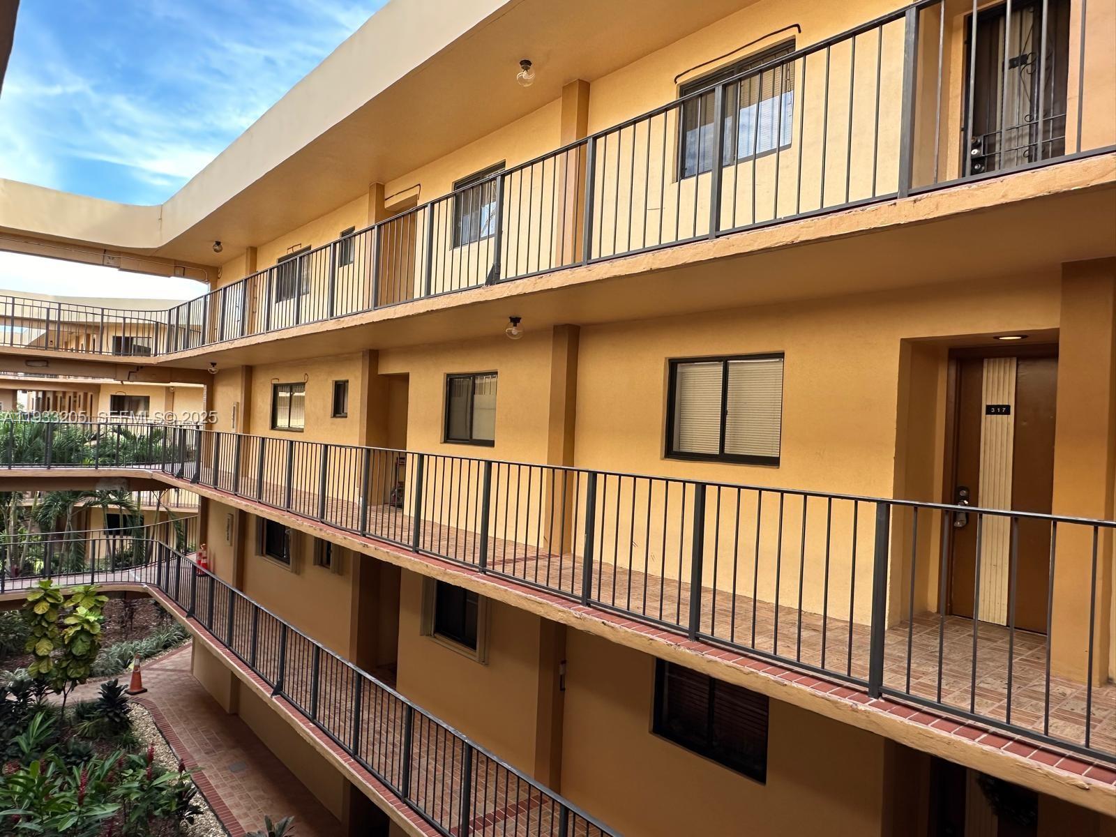 8420 Southwest 133rd Avenue Road, Unit 317 Miami, FL 33183 - Photo 16 of 22 a view of a large building with a window