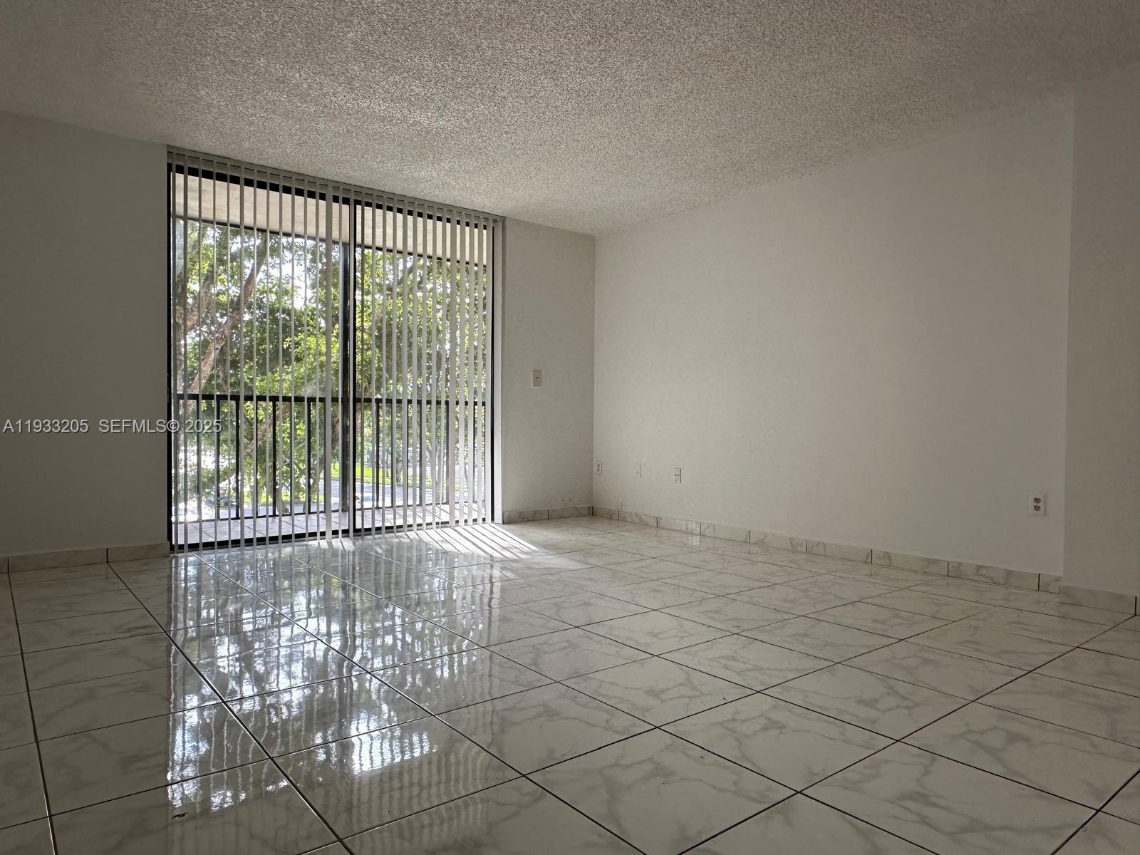 8420 Southwest 133rd Avenue Road, Unit 317 Miami, FL 33183 - Photo 7 of 22 a view of an empty room with a window
