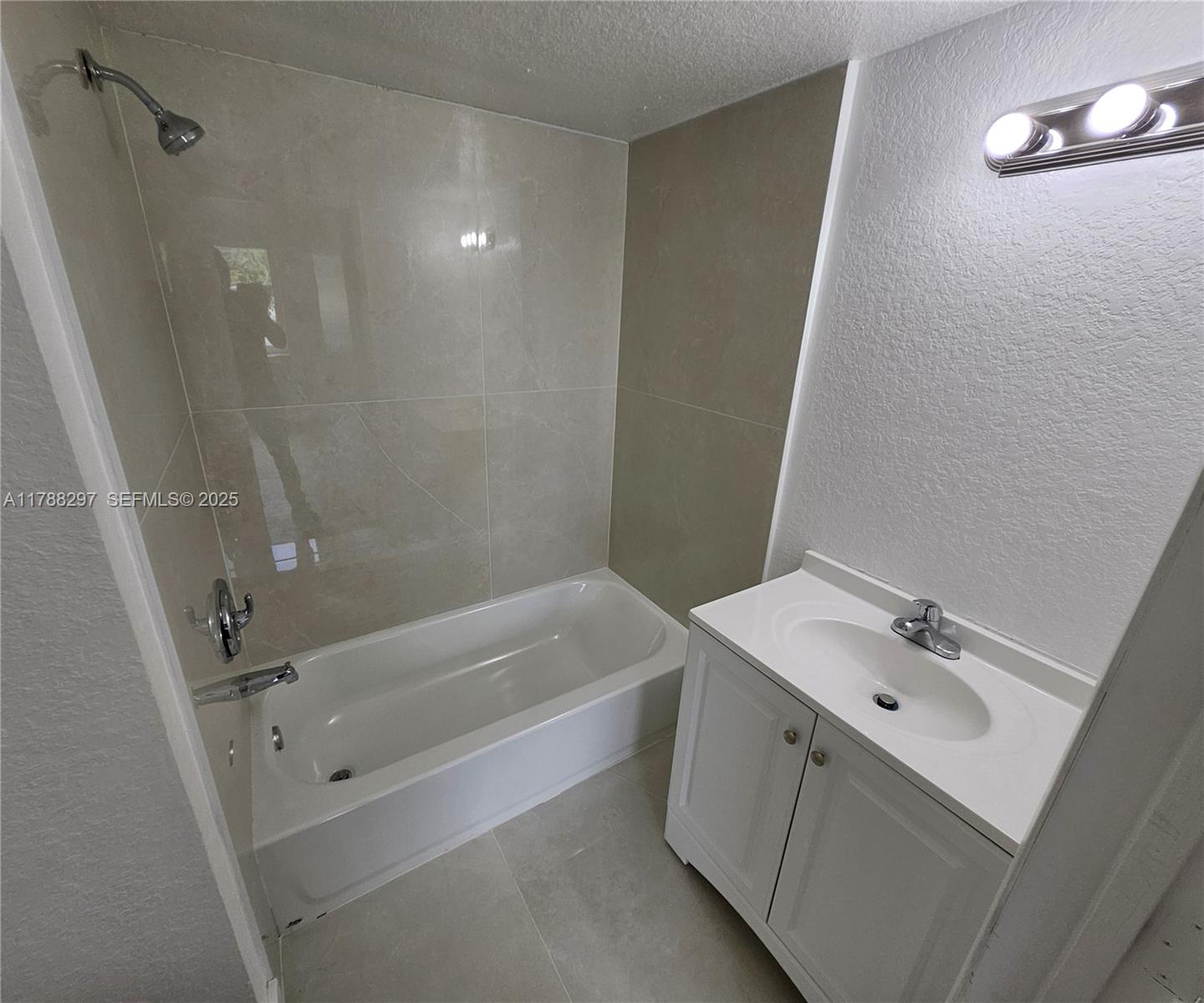 450 Northwest 84th Street, Unit 450 Miami, FL 33150 - Photo 25 of 28 a bathroom with a sink a toilet and shower