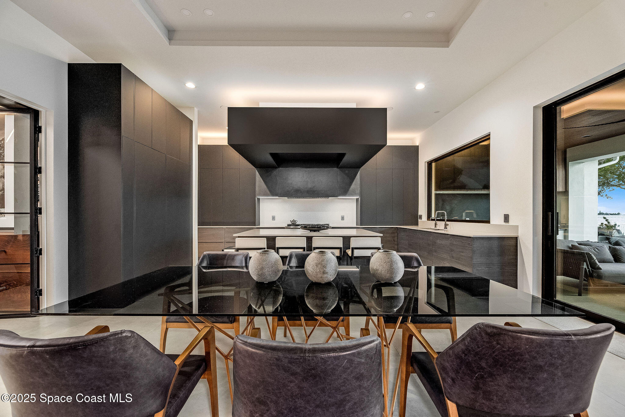 0 Crooked Mile Road Merritt Island, FL 32952 - Photo 11 of 19 a kitchen with stainless steel appliances kitchen island granite countertop a table and chairs
