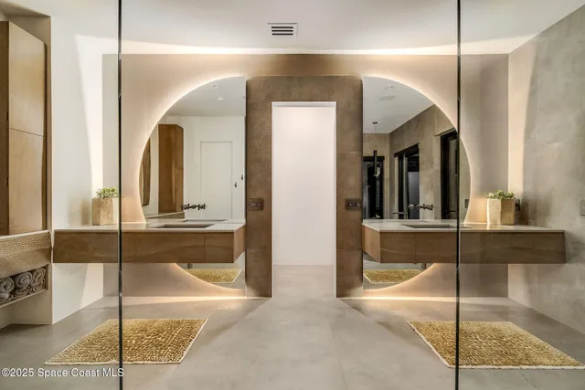 a living room with lots of furniture and windows