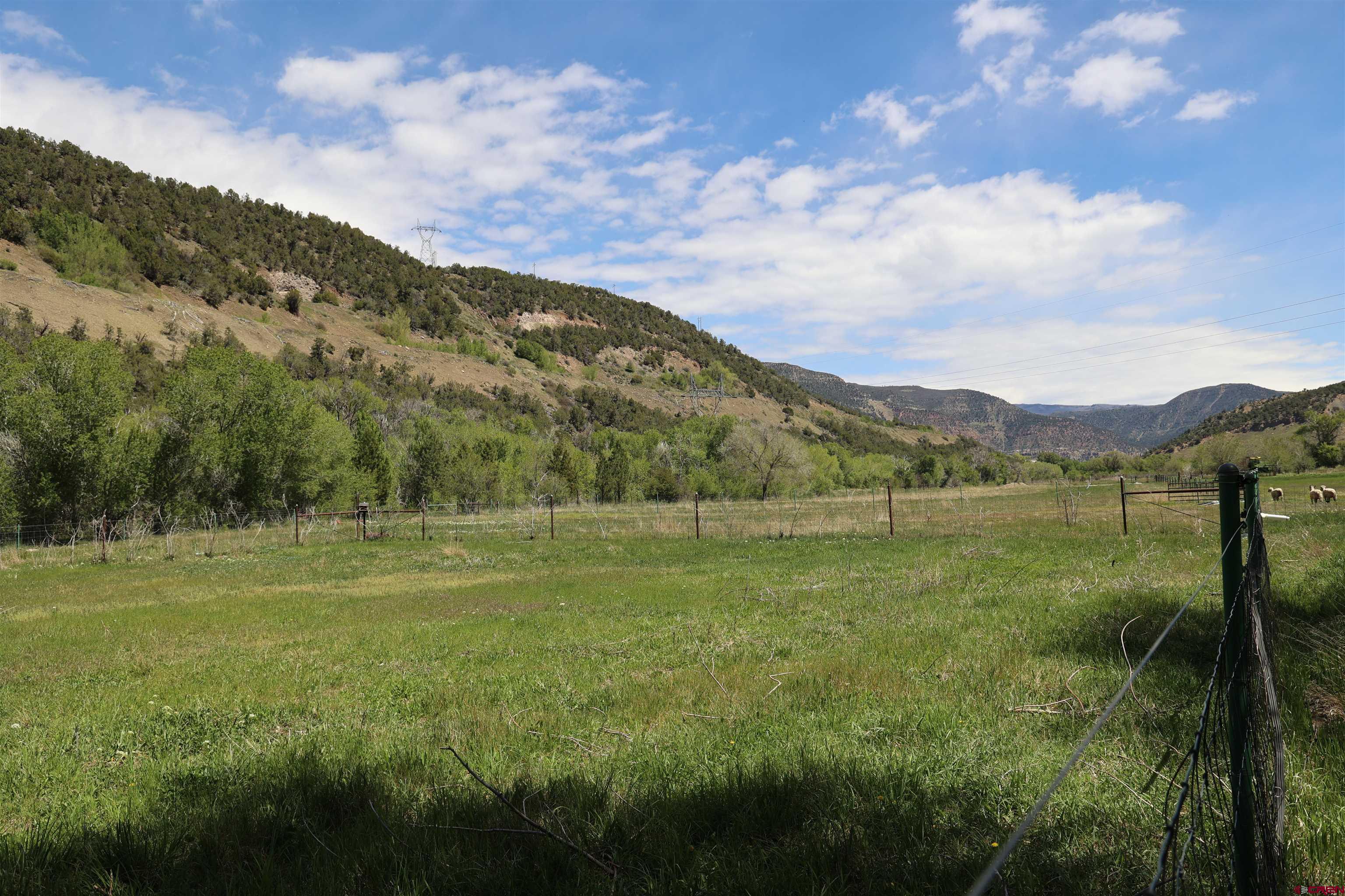 16459 Grange Road Paonia, CO 81428 - Photo 20 of 31 a view of a town with mountains in the background