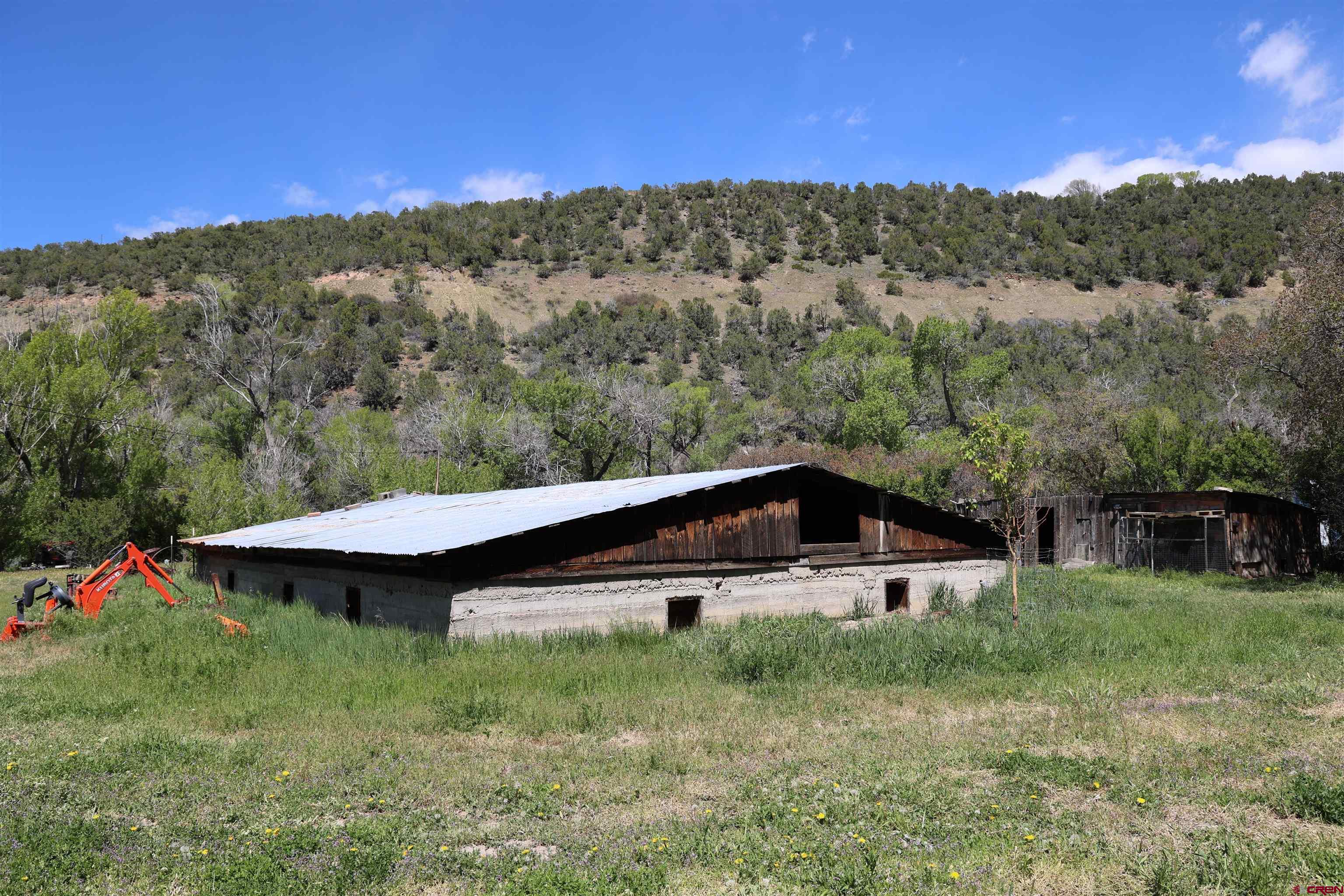 16459 Grange Road Paonia, CO 81428 - Photo 10 of 31 a view of a house with a yard