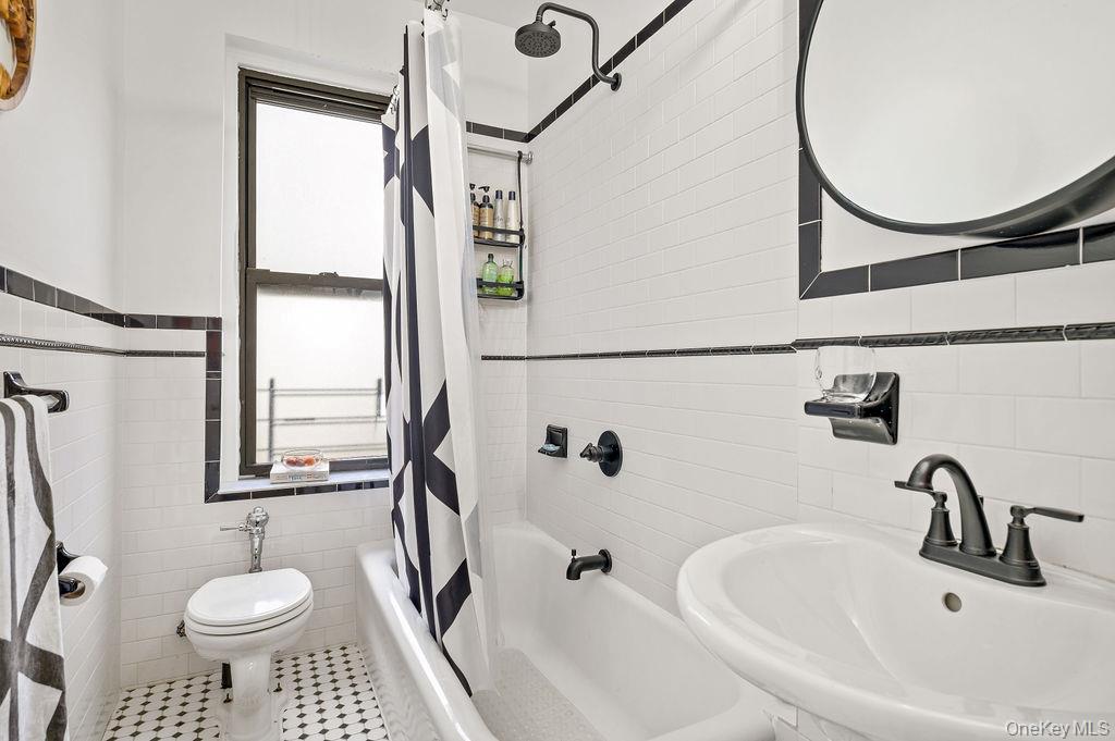 43 Calton Road, Unit 5C New Rochelle, NY 10804 - Photo 20 of 32 Full bath with tile walls and shower / bath combination with curtain