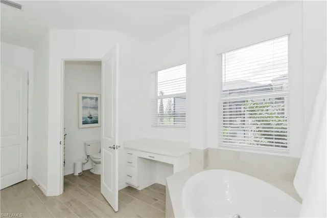 a bathroom with a bathtub and a sink
