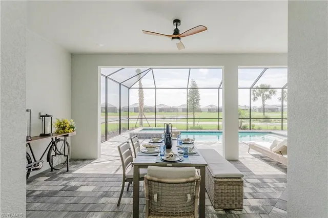 a living room with patio furniture