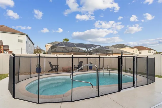 a view of a backyard fountain and a patio