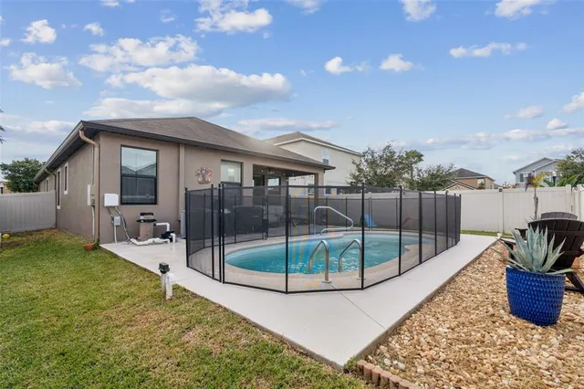 a view of a chair and tables in the patio