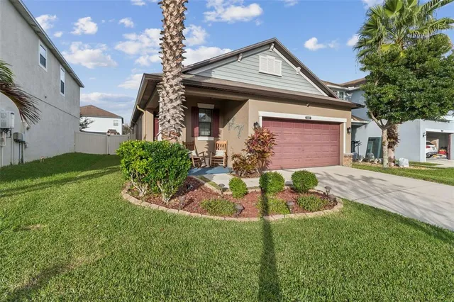 a front view of a house with garden