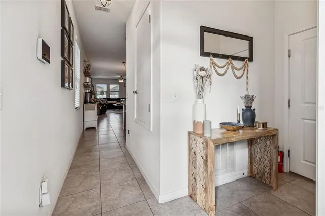 a view of a hallway with seating area