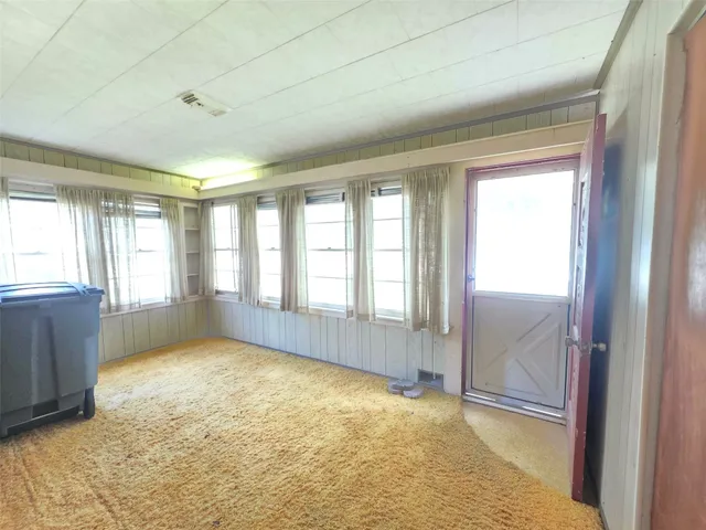 a view of an empty room and window