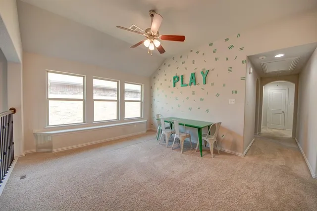 a view of a livingroom with furniture and a chandelier