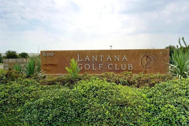 a view of outdoor space with garden and trees