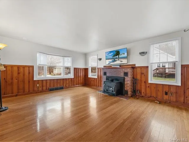 an empty room with furniture and fireplace