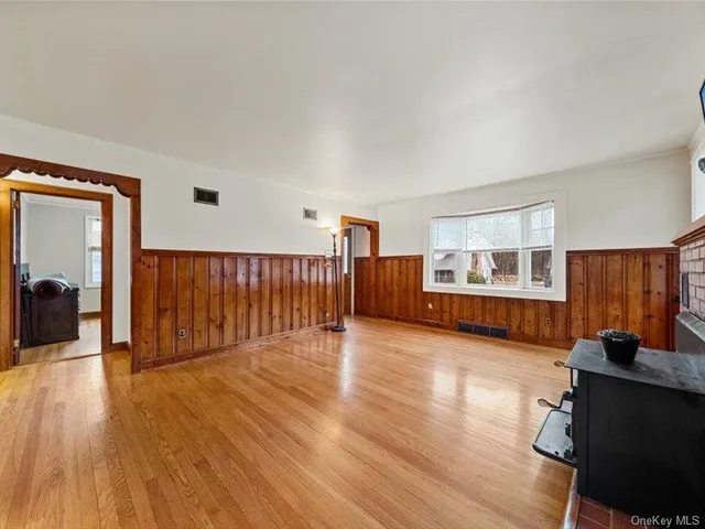 a living room with hard wood floors and a furniture