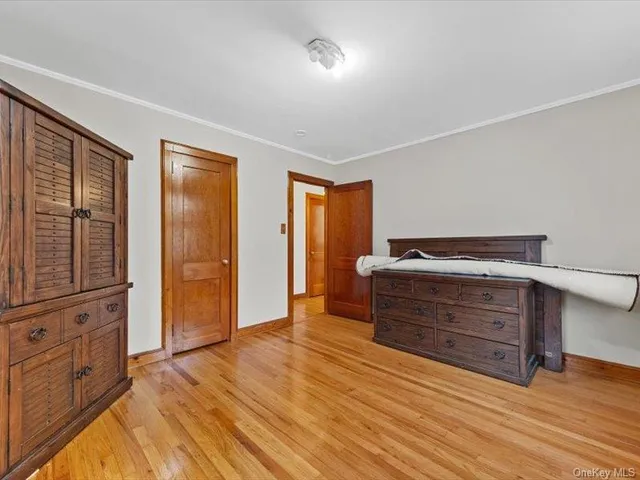 a room with a dresser and a mirror