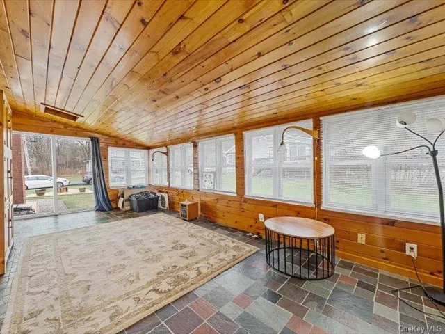 a room with natural light kitchen view and living room view