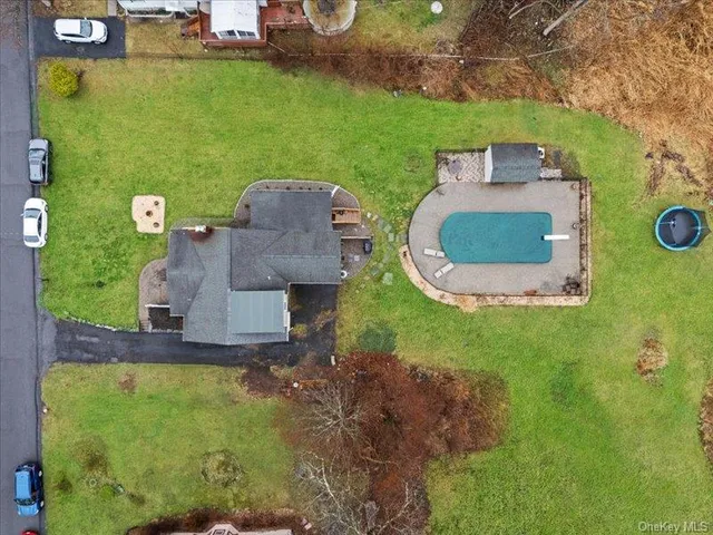 a aerial view of a house with a yard