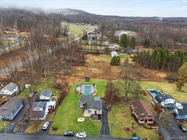 an aerial view of residential houses with outdoor space