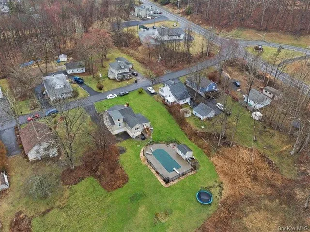 an aerial view of residential houses with outdoor space