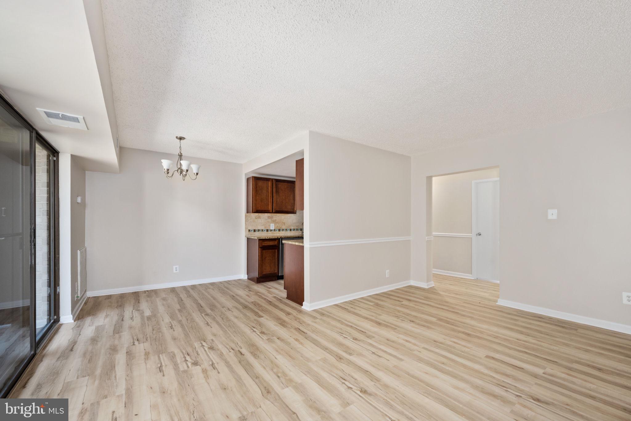 11659 Stoneview Square, Unit 11C Reston, VA 20191 - Photo 19 of 50 a view of empty room with wooden floor