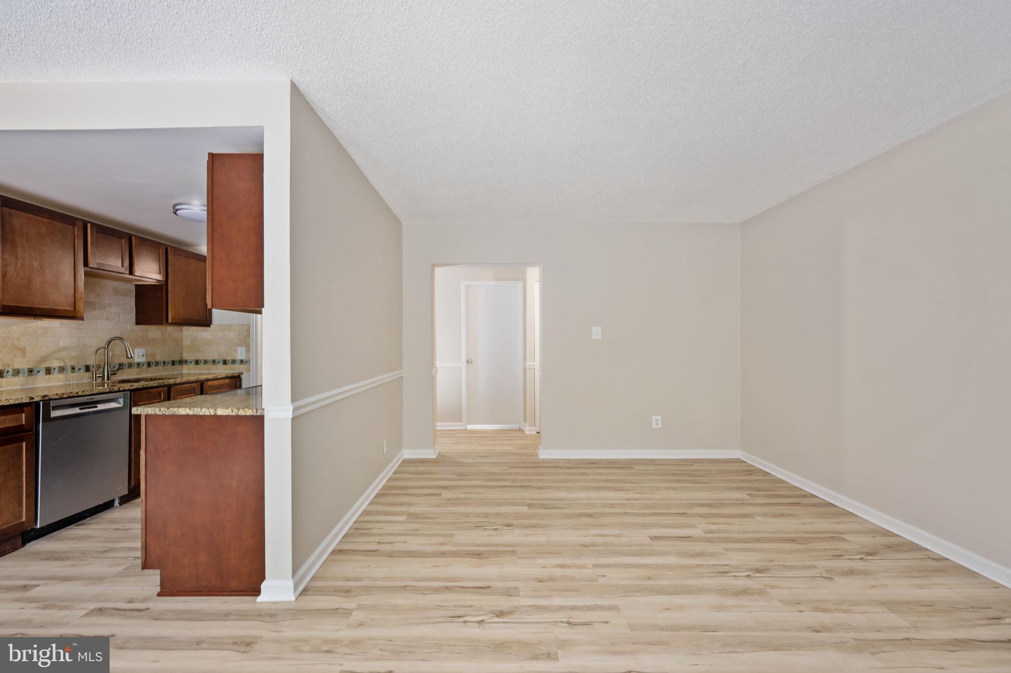 11659 Stoneview Square, Unit 11C Reston, VA 20191 - Photo 21 of 50 a view of a kitchen from the hallway