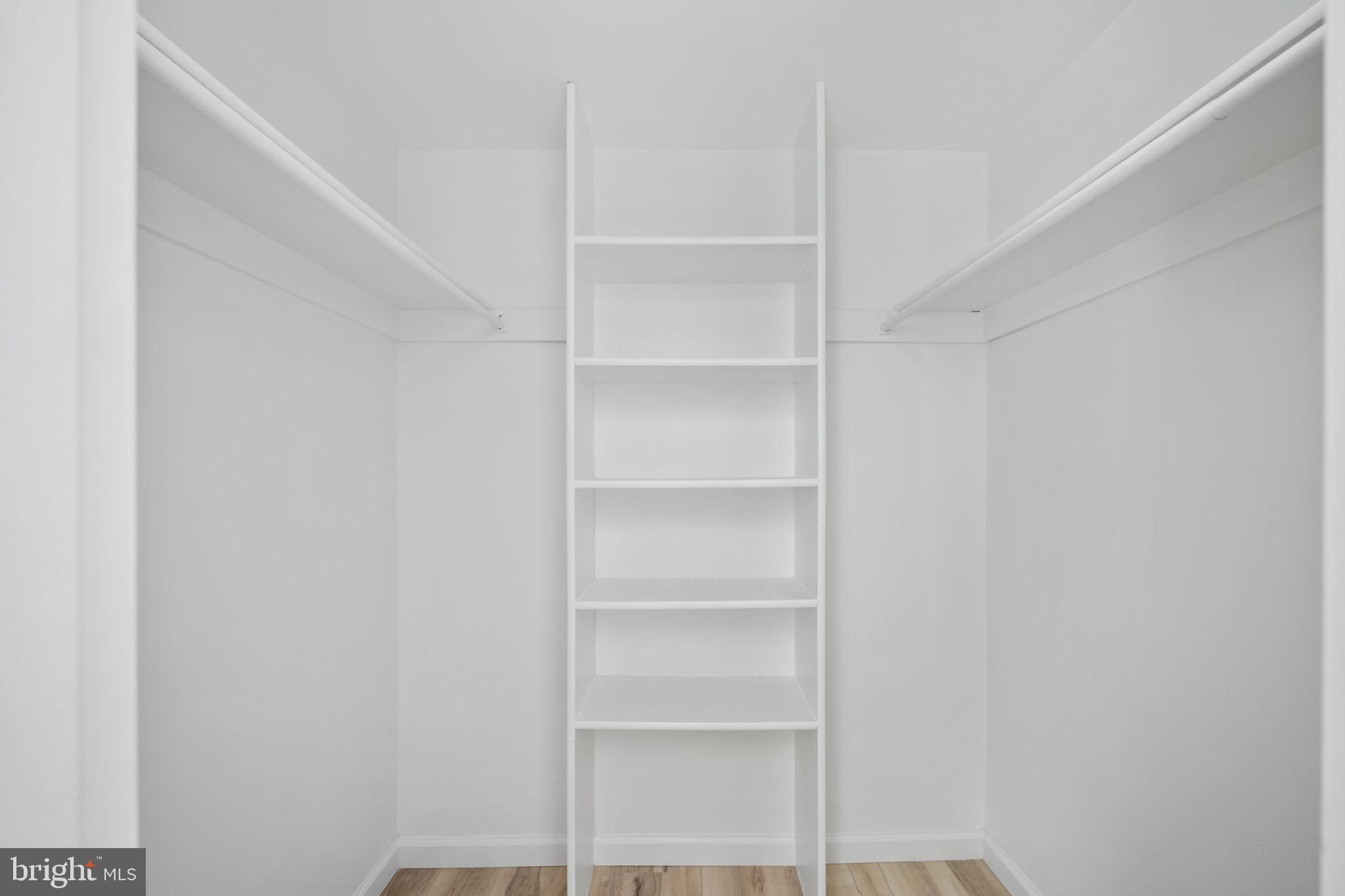 11659 Stoneview Square, Unit 11C Reston, VA 20191 - Photo 27 of 50 a view of walk in closet with empty racks