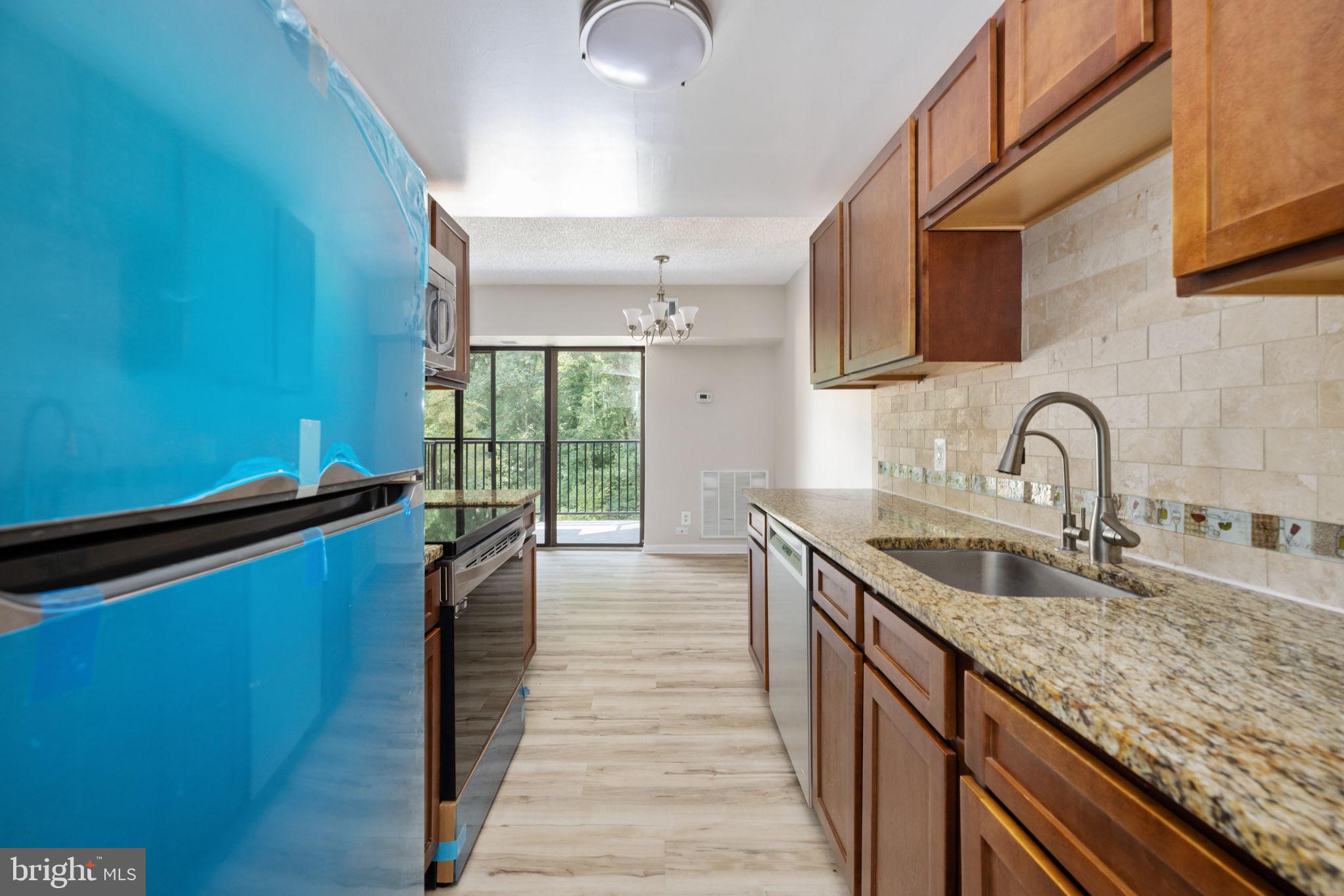 11659 Stoneview Square, Unit 11C Reston, VA 20191 - Photo 10 of 50 a kitchen with sink and cabinets