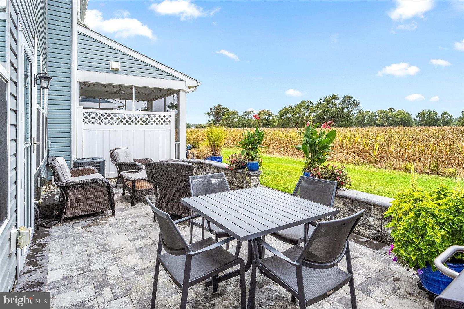 38057 Cross Gate Road Millville, DE 19967 - Photo 46 of 86 a view of a patio with furniture and a yard