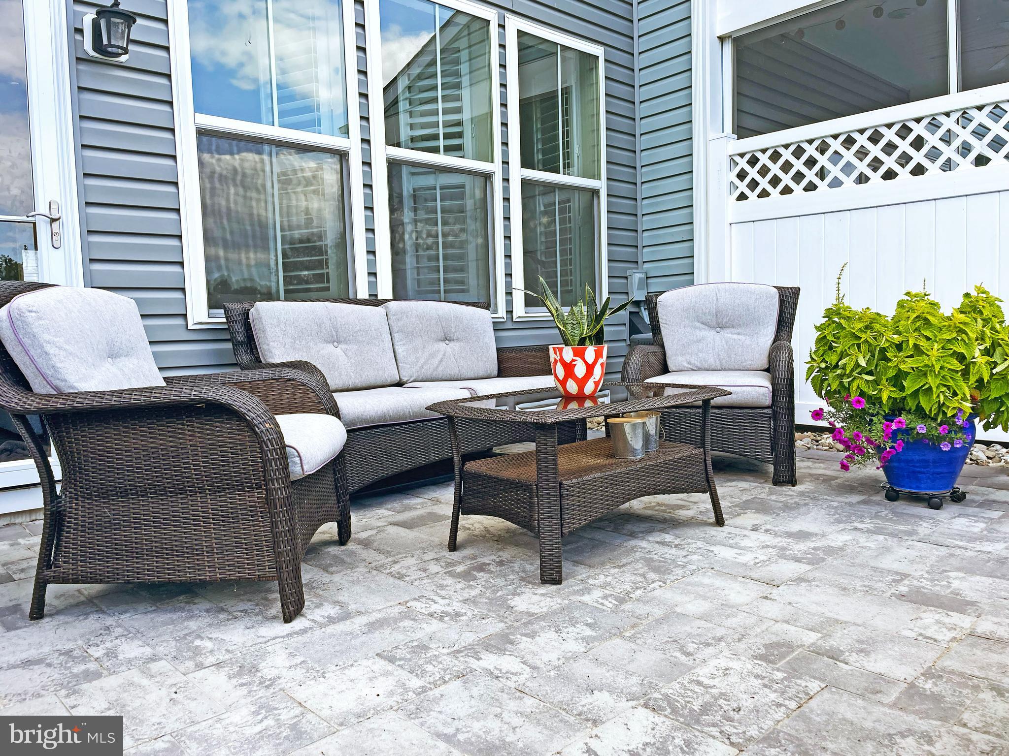 38057 Cross Gate Road Millville, DE 19967 - Photo 47 of 86 a outdoor living space with furniture and a potted plant