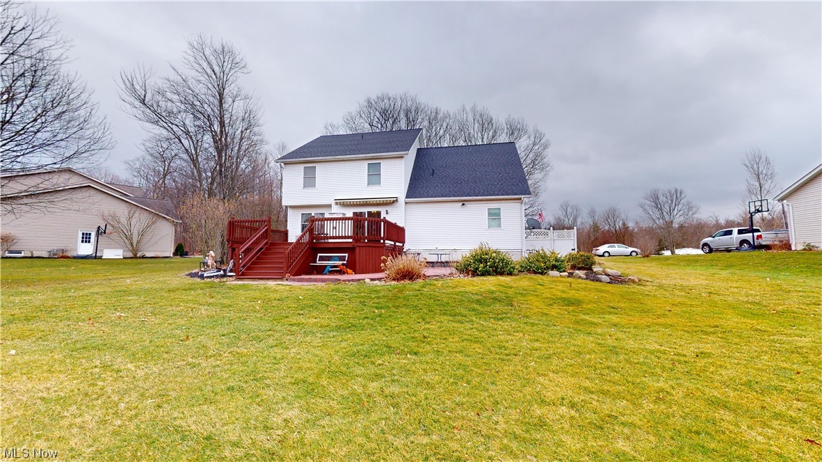 12431 Carter Road Painesville, OH 44077 - Photo 26 of 33 Rear view of property with a yard and a wooden deck