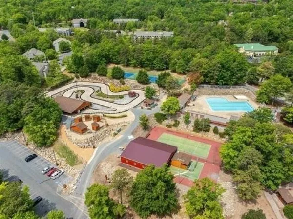 an aerial view of a house with a swimming pool