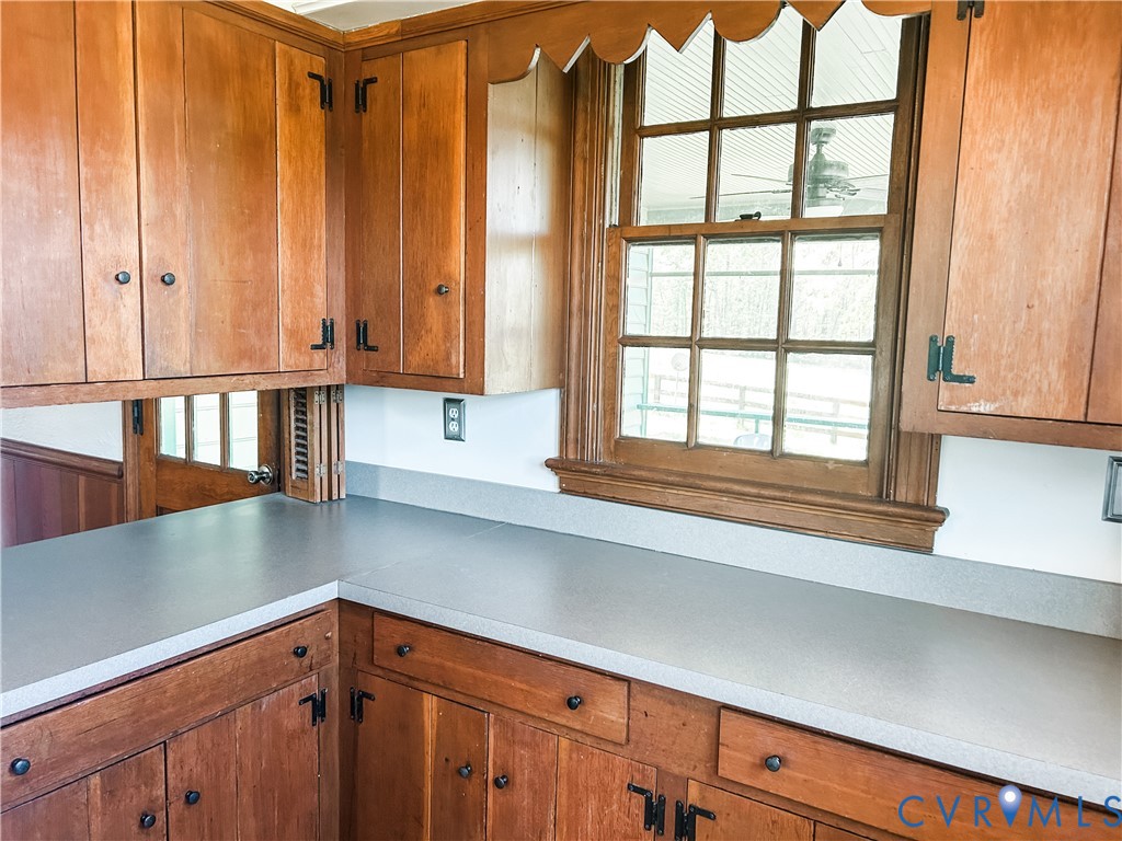 1346 Hockett Road Manakin-Sabot, VA 23103 - Photo 11 of 25 Kitchen with brown cabinetry and light countertops