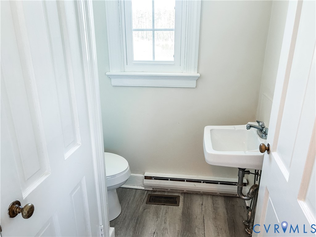 1346 Hockett Road Manakin-Sabot, VA 23103 - Photo 12 of 25 Bathroom featuring a baseboard heating unit, a sin
