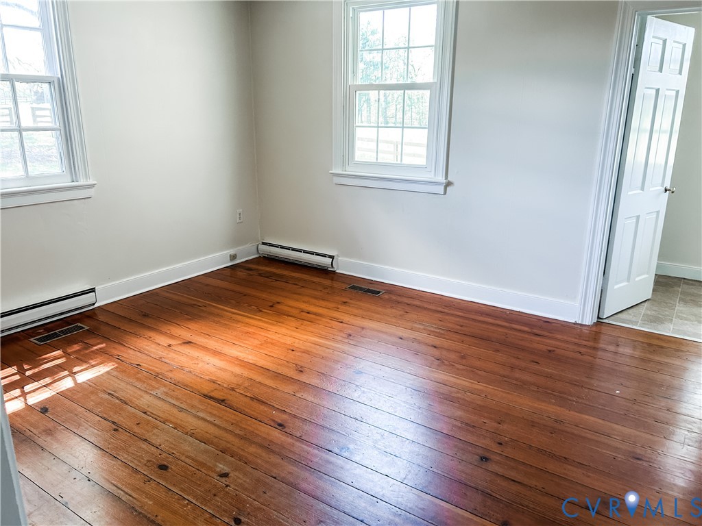 1346 Hockett Road Manakin-Sabot, VA 23103 - Photo 17 of 25 Spare room featuring baseboard heating, a baseboar