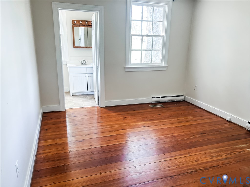 1346 Hockett Road Manakin-Sabot, VA 23103 - Photo 18 of 25 Spare room with a baseboard heating unit, a sink,