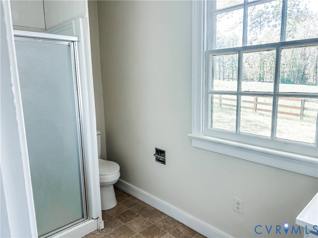 1346 Hockett Road Manakin-Sabot, VA 23103 - Photo 19 of 25 Full bathroom with baseboards, toilet, a stall sho
