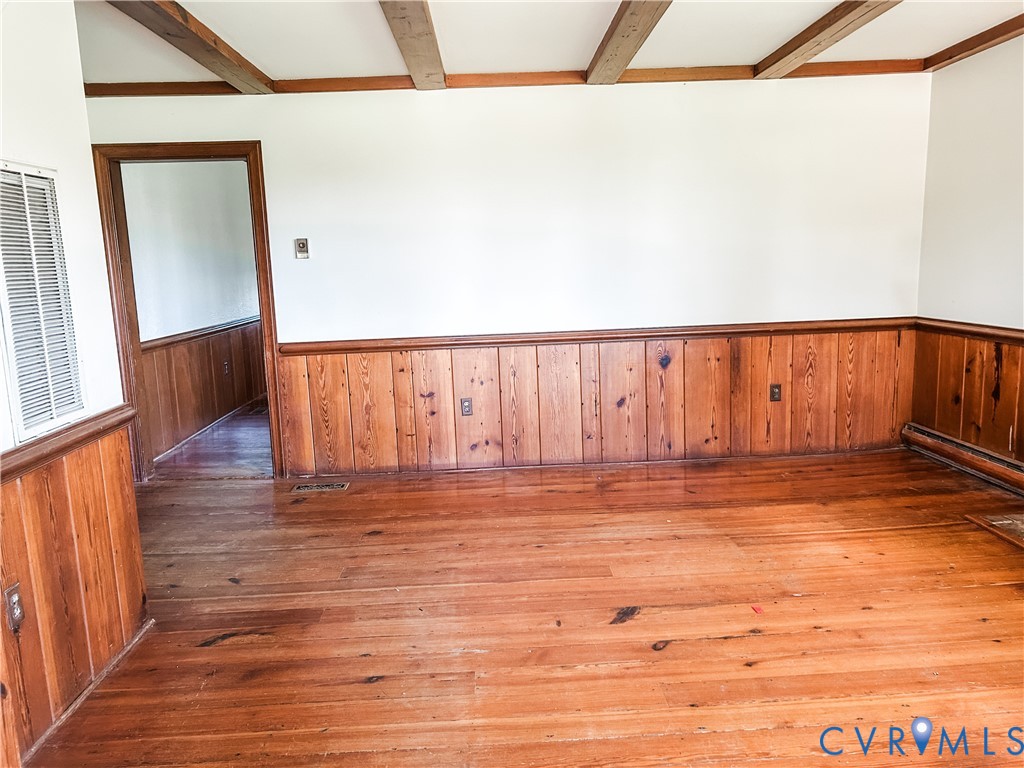 1346 Hockett Road Manakin-Sabot, VA 23103 - Photo 4 of 25 Empty room featuring beamed ceiling, a wainscoted