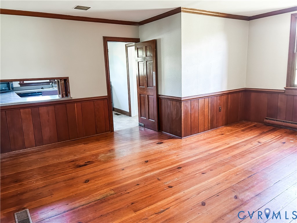 1346 Hockett Road Manakin-Sabot, VA 23103 - Photo 5 of 25 Empty room featuring wainscoting, hardwood / wood-