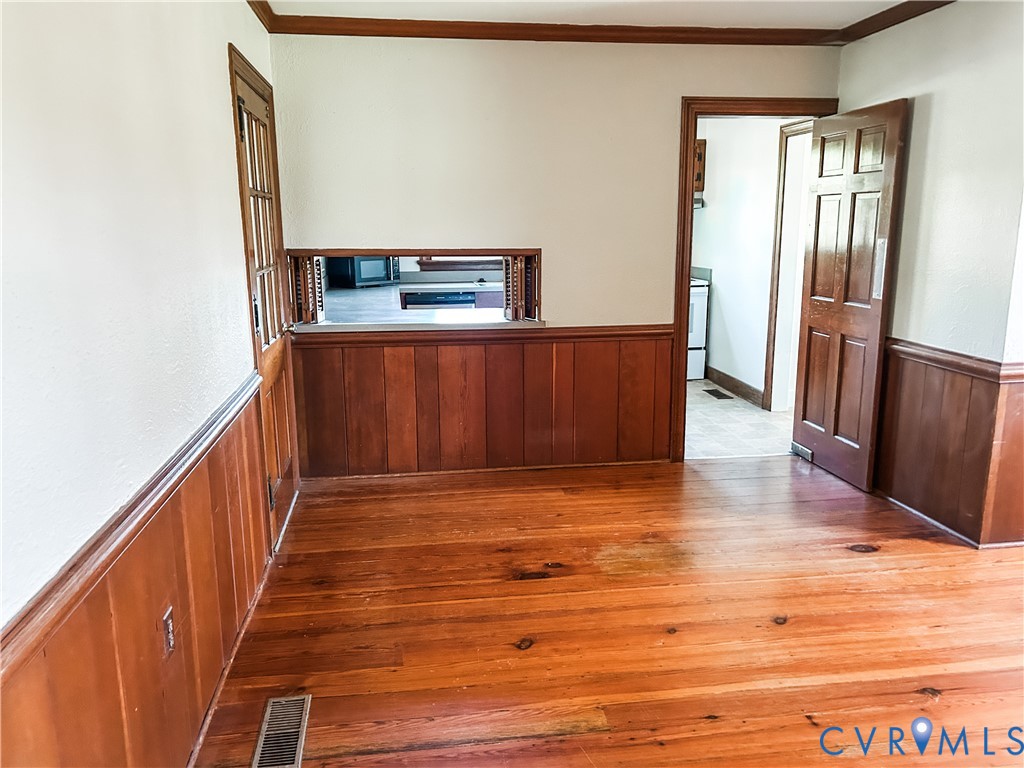 1346 Hockett Road Manakin-Sabot, VA 23103 - Photo 7 of 25 Hall with wainscoting, visible vents, hardwood / w