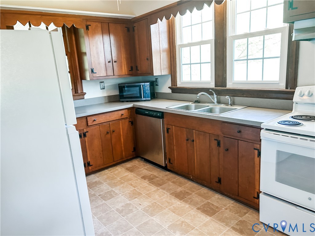 1346 Hockett Road Manakin-Sabot, VA 23103 - Photo 8 of 25 Kitchen with brown cabinets, a sink, white applian