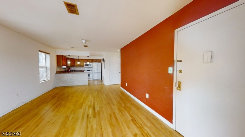 534 Maple Avenue Elizabeth, NJ 07202 - Photo 11 of 48 a view of a bedroom with wooden floor