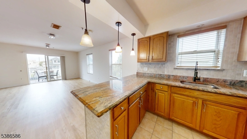 534 Maple Avenue Elizabeth, NJ 07202 - Photo 20 of 48 a kitchen with granite countertop a sink a counter top space and cabinets