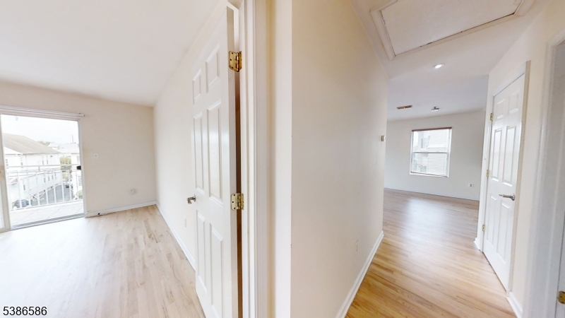 534 Maple Avenue Elizabeth, NJ 07202 - Photo 24 of 48 a view of a hallway with wooden floor and a bathroom