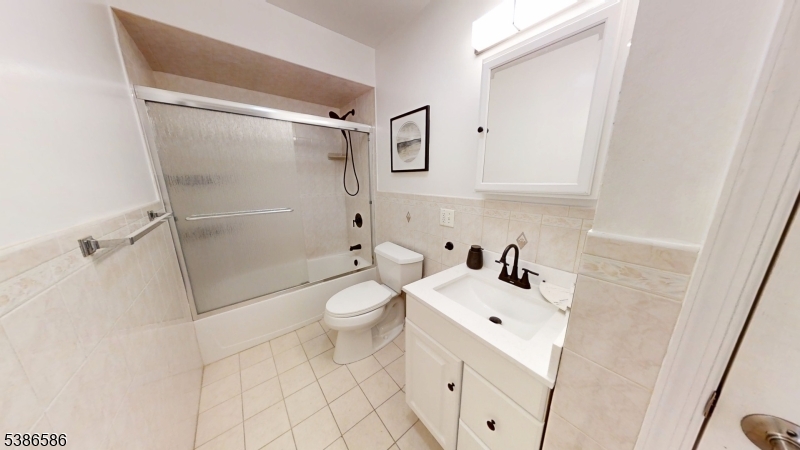 534 Maple Avenue Elizabeth, NJ 07202 - Photo 36 of 48 a white toilet sitting next to a bathroom sink