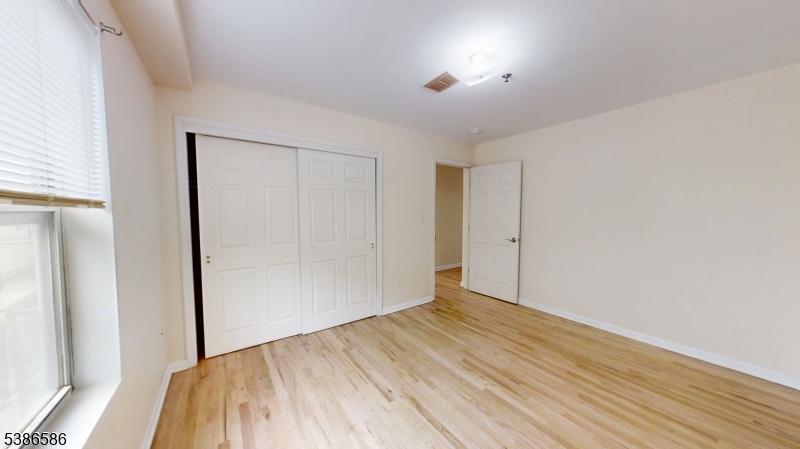 534 Maple Avenue Elizabeth, NJ 07202 - Photo 39 of 48 a view of empty room with wooden floor