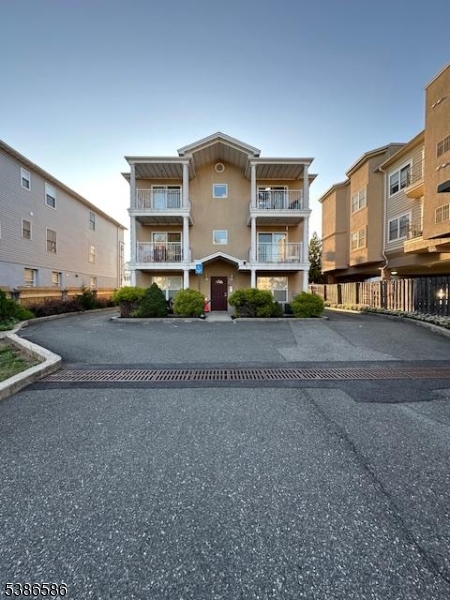 534 Maple Avenue Elizabeth, NJ 07202 - Photo 6 of 48 a front view of a house with a yard