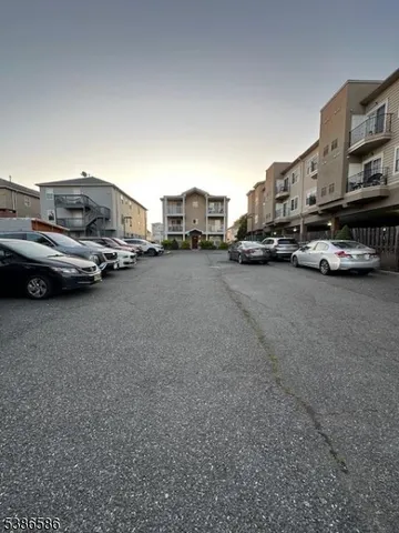 a view of an empty room and wooden floor